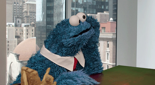 Bored-Cookie-Monster-Waiting-For-The-Time-To-Pass-At-Work.gif