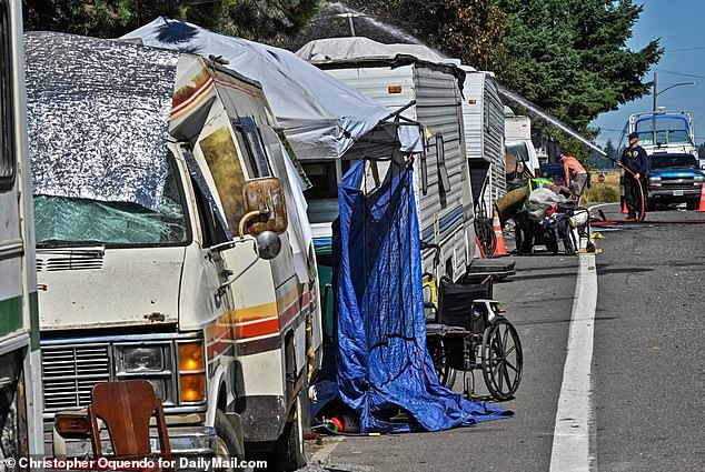 74438721-12417411-The_illegal_row_of_trailers_and_RVs_runs_along_NE_33rd_Drive_in_-a-5_1692300408062.jpg