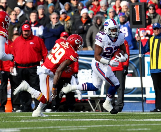 Nov 3, 2013; Orchard Park, NY, USA; Buffalo Bills running back Fred Jackson (22) runs the ball while Kansas City Chiefs strong safety Eric Berry (29) tries to make the tackle during the second half at Ralph Wilson Stadium. Chiefs beat the Bills 23 to 13. Mandatory Credit: Timothy T. Ludwig-USA TODAY Sports