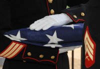 marine with folded flag.jpg