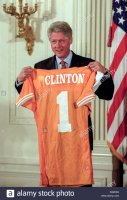 us-president-bill-clinton-holds-up-a-team-jersey-presented-him-by-D32RD3.jpg