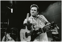 Jim-Marshall-Johnny-Cash-flips-the-bird-at-St-Quentin-prison.png