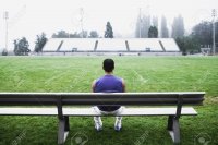 16070309-male-athlete-sitting-on-bench.jpg