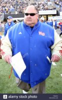 kansas-jayhawks-head-football-coach-mark-mangino-takes-to-the-field-before-the-start-of-a-game...jpg