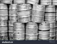 stock-photo-range-of-stacked-beer-casks-of-kegs-in-black-and-white-384702109.jpg