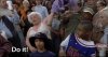 old woman waving shirt in a  crowd.jpg