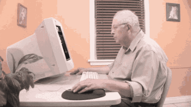 old-man-using-a-computer-gfp33gsvgrg8o53p.gif