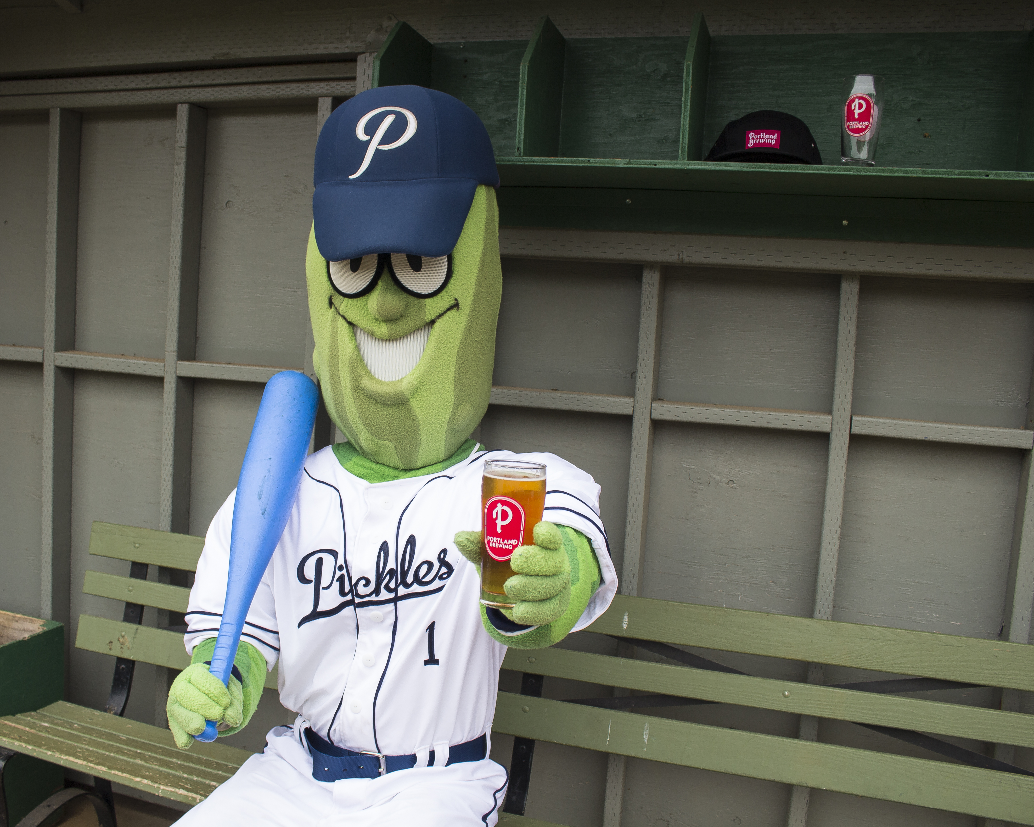 Dillon-The-Pickle-in-the-dugout-with-a-Dills-Pils.-image-courtesy-of-Portland-Brewing.jpg