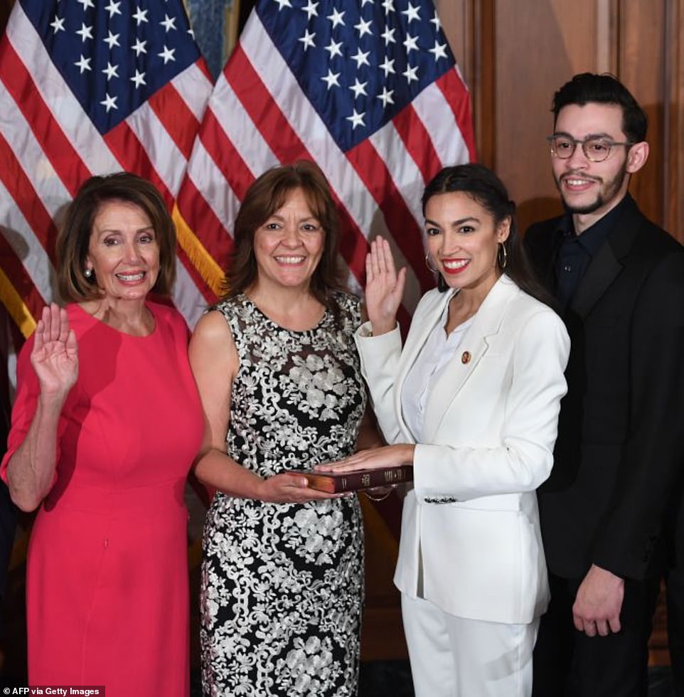 49263209-10099425-AOC_was_elected_to_New_York_s_14th_congressional_district_in_201-a-3_1634430025604.jpg