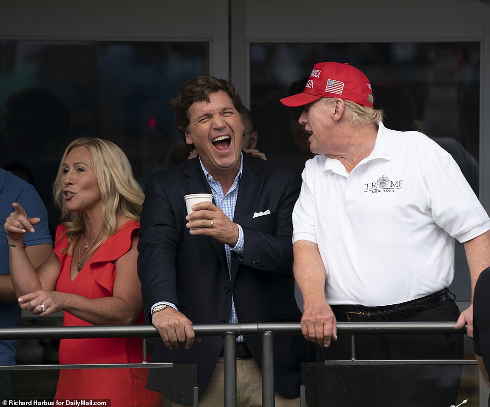 60921129-11067081-Presidential_hopefuls_Donald_Trump_and_Tucker_Carlson_were_seen_-a-28_1659315322711.jpg