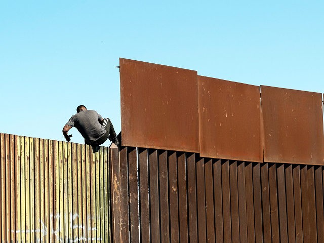 illegal-immigrant-jumps-border-fence-from-mexico-feb11-2020-getty-640x480.jpg
