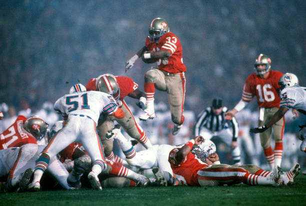 roger-craig-of-the-san-francisco-49ers-carries-the-ball-against-the-picture-id855604798