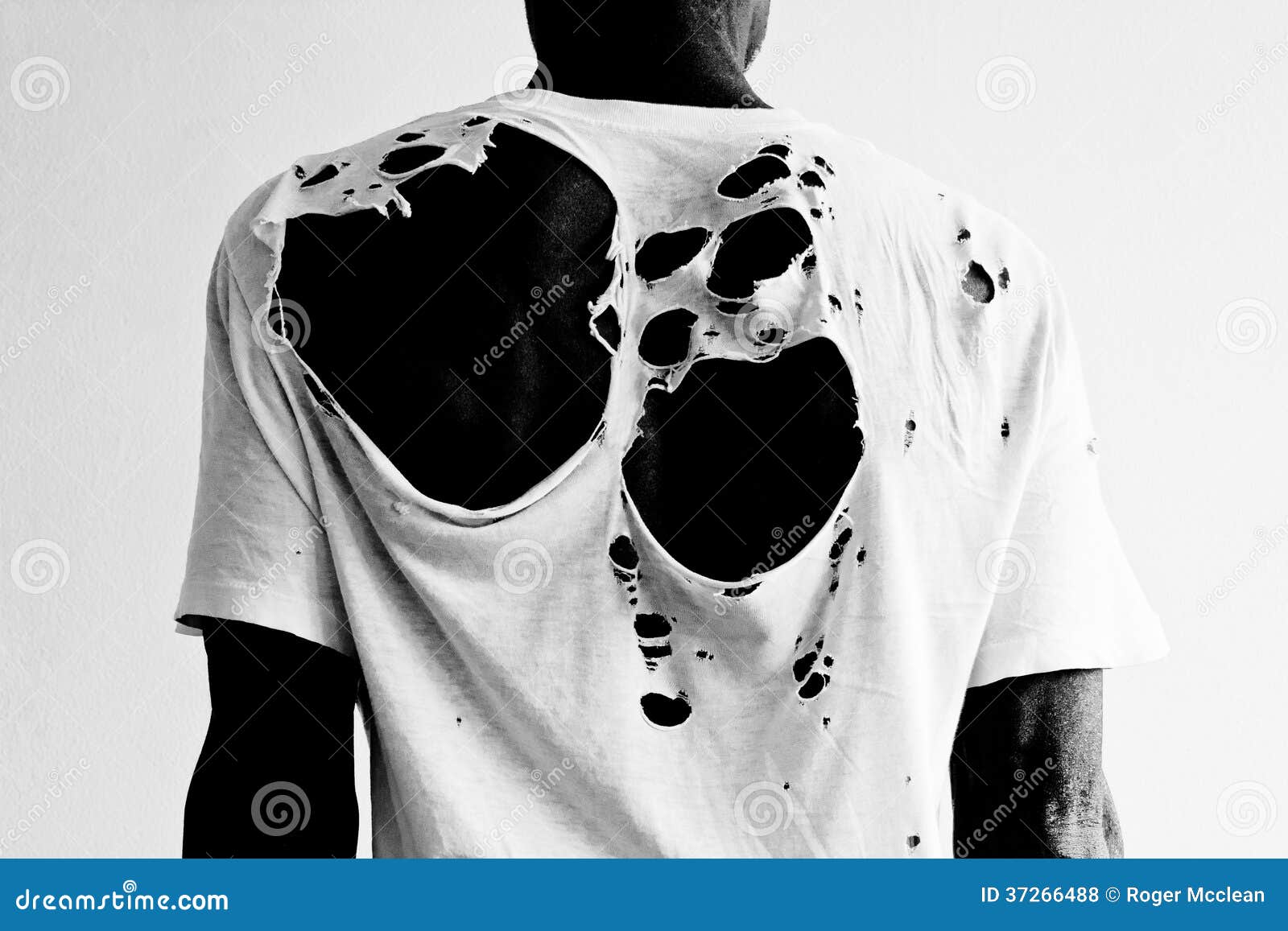 black-man-wearing-torn-white-t-shirt-back-ripped-holy-37266488.jpg
