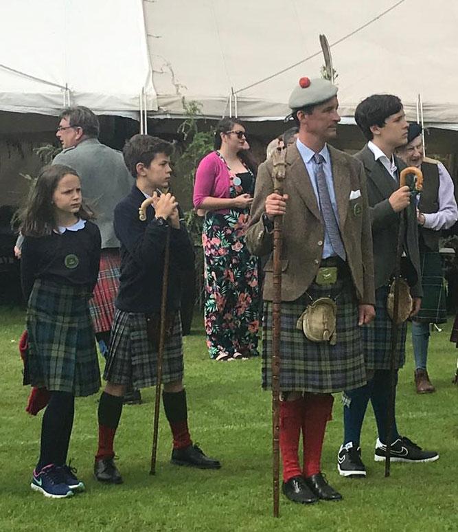 his-grace-the-duke-of-argyll-with-his-children-archie-marquis-of-lorne-lord-rory-campbell-and-lady-charlotte-mary-campbell-stand-in-review-at-the-2019-inveraray-highland-games-scotland.jpg